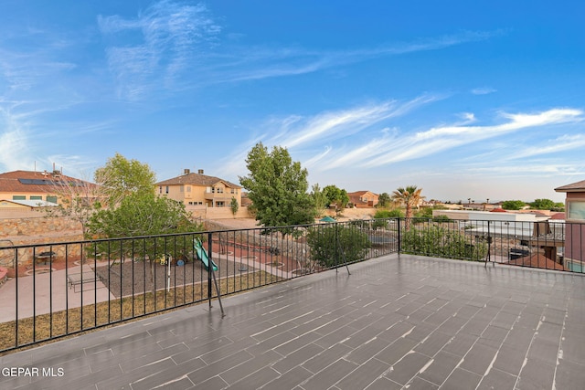view of patio / terrace with a residential view and a balcony
