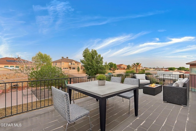 view of patio featuring a residential view and an outdoor fire pit