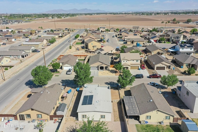 birds eye view of property with a mountain view and a residential view