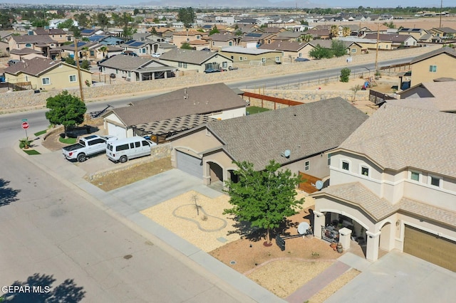 birds eye view of property with a residential view