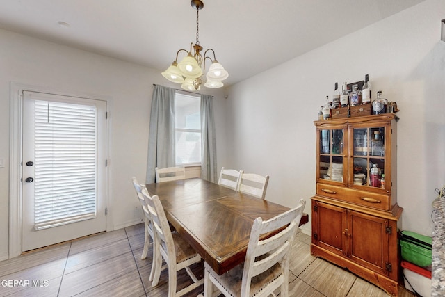 dining space featuring a notable chandelier
