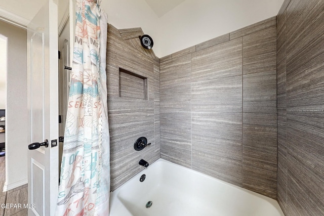 bathroom featuring shower / bath combination with curtain