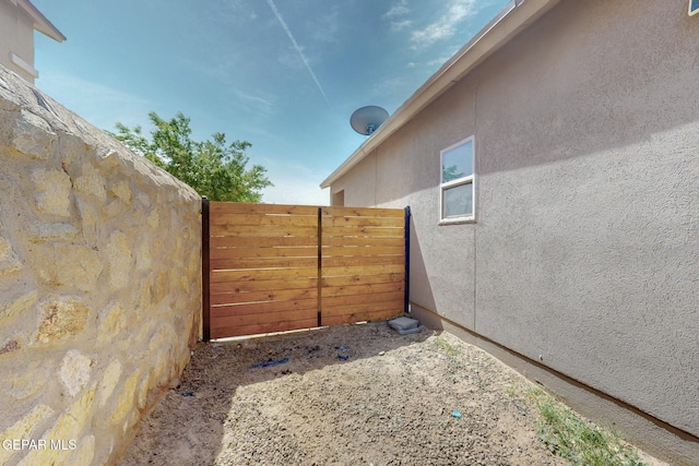 view of gate featuring fence