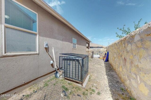 view of home's exterior with a fenced backyard and stucco siding