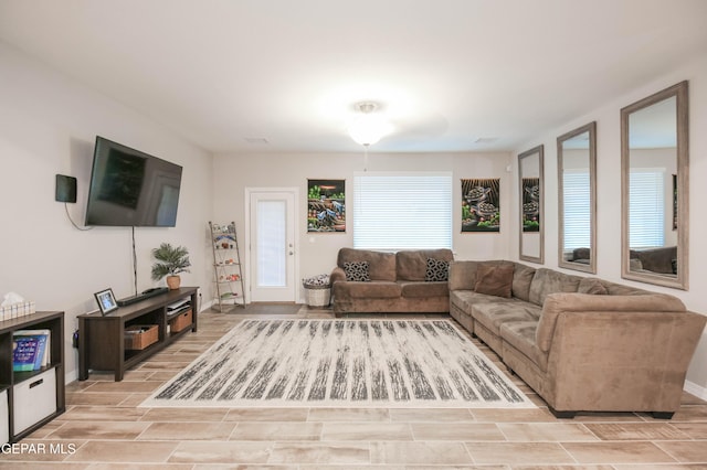 10716 Drew Pearson Dr, El Paso, TX 79924 - living room featuring wood tiled floor and baseboards