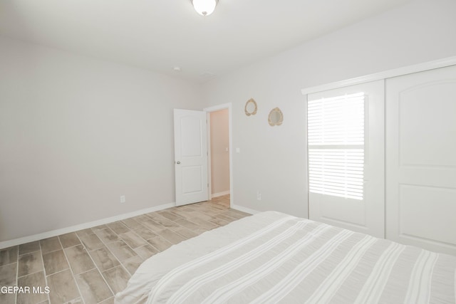 10716 Drew Pearson Dr, El Paso, TX 79924 - bedroom featuring baseboards and wood finished floors