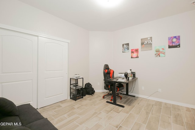 10716 Drew Pearson Dr, El Paso, TX 79924 - office area with baseboards and wood tiled floor