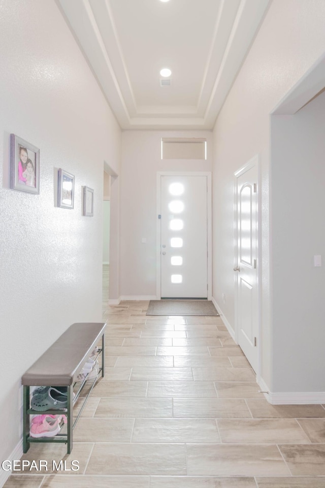 10716 Drew Pearson Dr, El Paso, TX 79924 - entrance foyer with baseboards, wood finish floors, and a raised ceiling