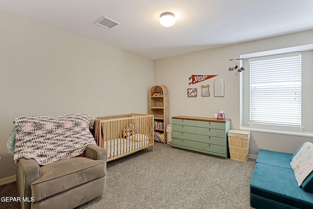 carpeted bedroom with baseboards and visible vents