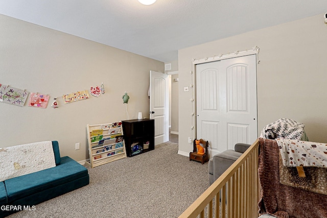 bedroom with a closet, baseboards, and carpet flooring