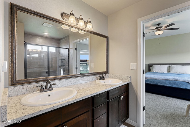 ensuite bathroom featuring visible vents, a sink, ensuite bathroom, and a stall shower