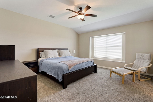 carpeted bedroom featuring visible vents, baseboards, ceiling fan, and vaulted ceiling
