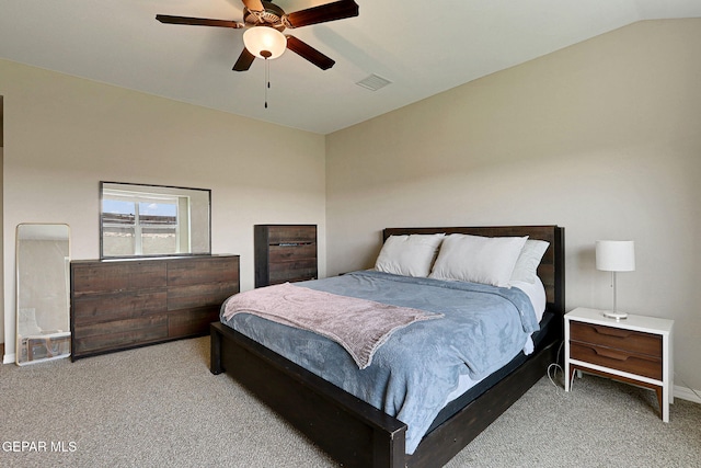 carpeted bedroom with a ceiling fan, baseboards, visible vents, and vaulted ceiling