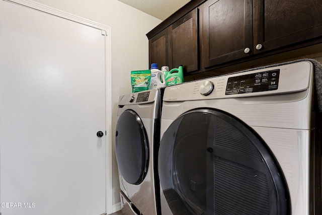 laundry area with cabinet space and washer and dryer