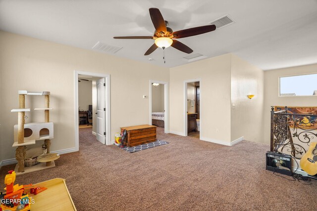 interior space with visible vents, a ceiling fan, and baseboards