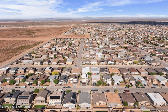 aerial overview of property's location featuring nearby suburban area and mountains