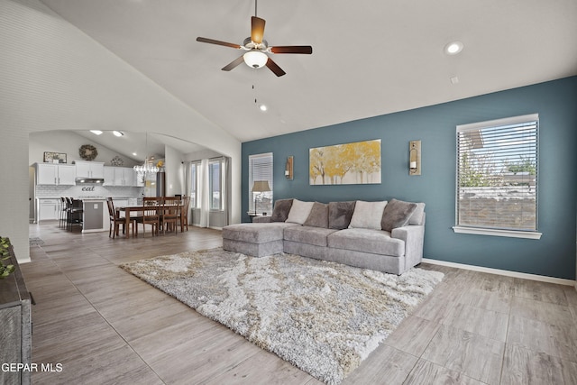 living area with vaulted ceiling, a ceiling fan, and recessed lighting