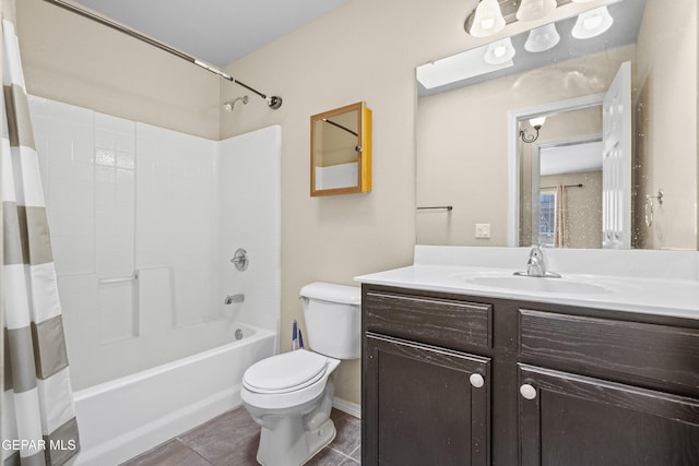 full bathroom with vanity, tile patterned flooring, shower / bath combo with shower curtain, and toilet