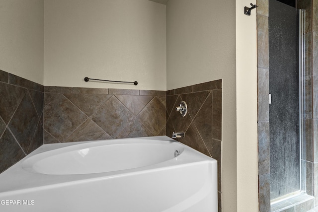 full bathroom featuring a bath