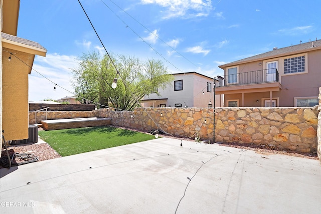 view of patio with cooling unit and a fenced backyard