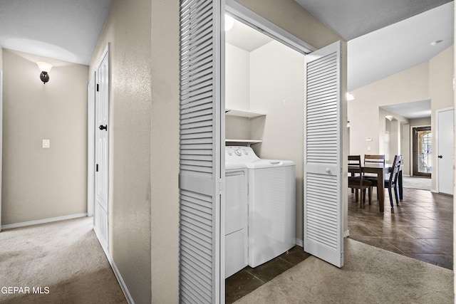 laundry area featuring baseboards, laundry area, carpet flooring, and independent washer and dryer
