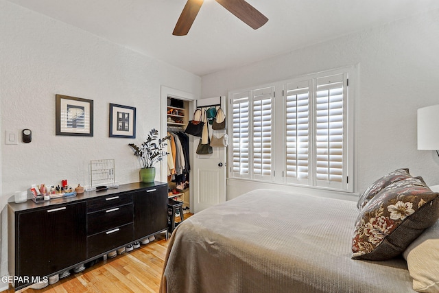 bedroom featuring a closet, ceiling fan, and light wood-style floors