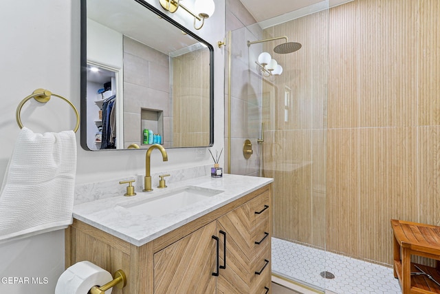 bathroom with vanity and walk in shower