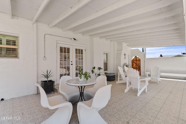view of patio / terrace with french doors and fence