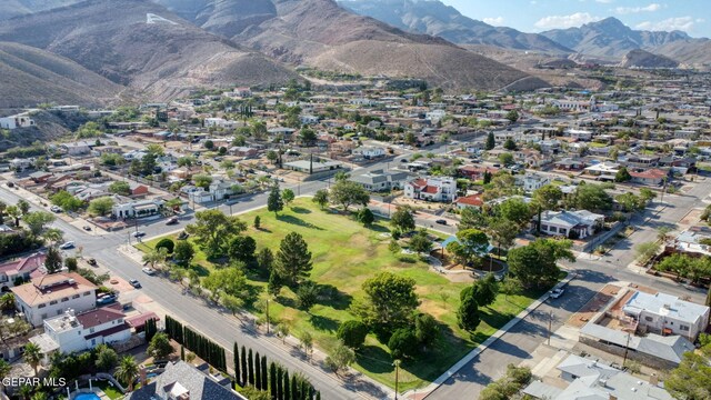 drone / aerial view featuring a residential view and a mountain view