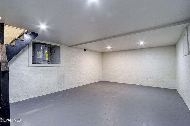finished below grade area featuring stairway and electric panel