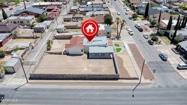 birds eye view of property with a residential view