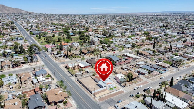 drone / aerial view featuring a residential view and a mountain view