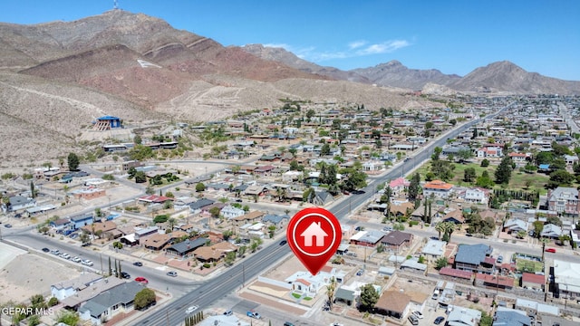 drone / aerial view featuring a residential view and a mountain view