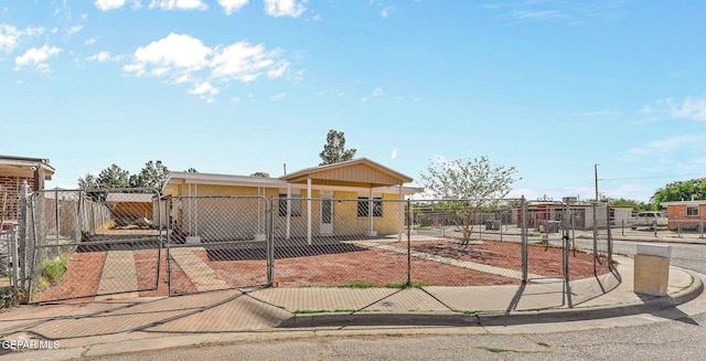 view of front facade featuring a gate and fence private yard