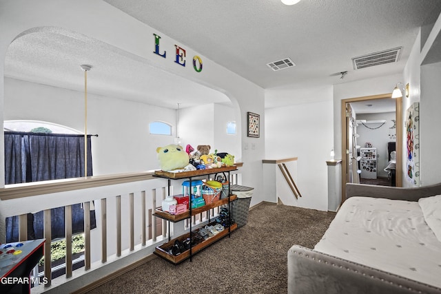11400 Pifas Nevarez Pl, El Paso, TX 79934 - carpeted bedroom with arched walkways, a textured ceiling, and visible vents