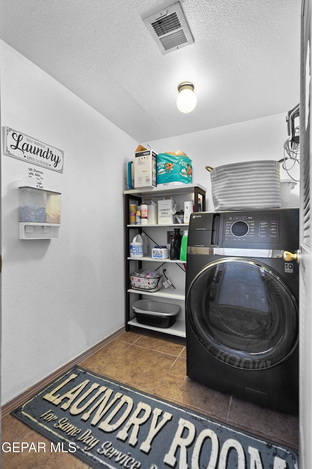 11400 Pifas Nevarez Pl, El Paso, TX 79934 - clothes washing area featuring laundry area, a textured ceiling, visible vents, baseboards, and washer / dryer
