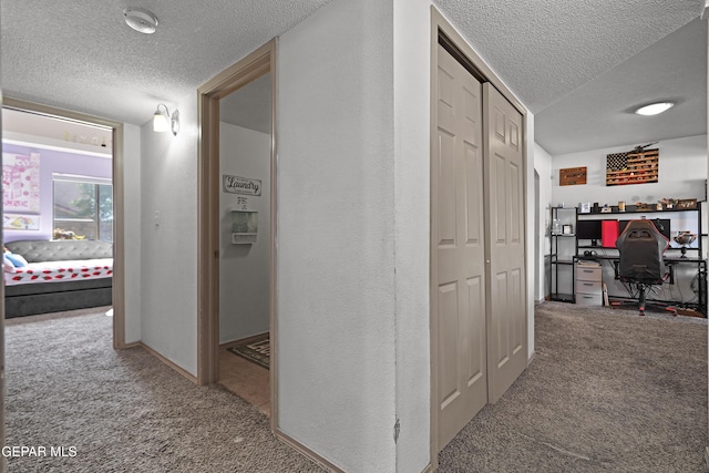 11400 Pifas Nevarez Pl, El Paso, TX 79934 - hall featuring a textured ceiling, carpet flooring, and baseboards