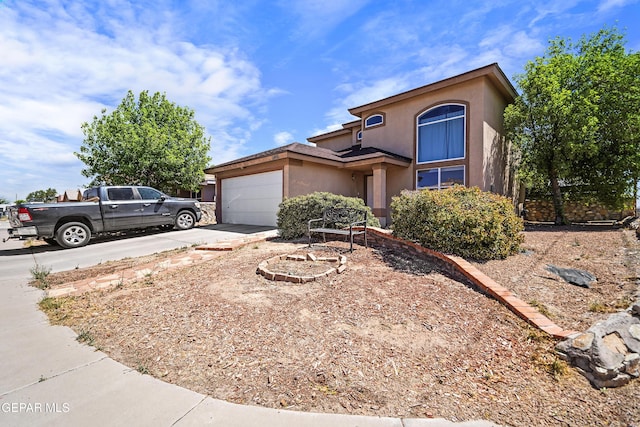 11400 Pifas Nevarez Pl, El Paso, TX 79934 - view of front facade with a garage, stucco siding, and driveway