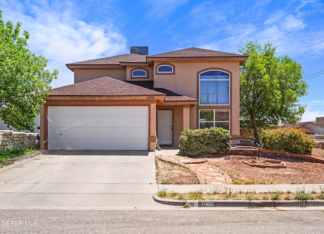 11400 Pifas Nevarez Pl, El Paso, TX 79934 - view of front of home featuring roof with shingles, concrete driveway, an attached garage, and stucco siding