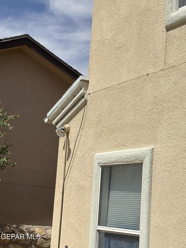 details featuring stucco siding