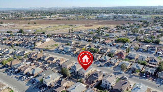 birds eye view of property with a mountain view and a residential view