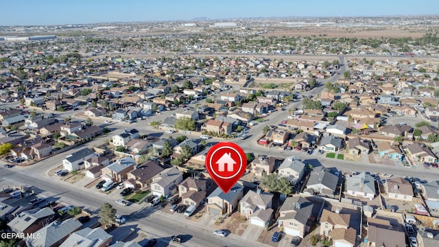 birds eye view of property with a residential view