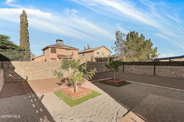 view of yard featuring a patio and a fenced backyard