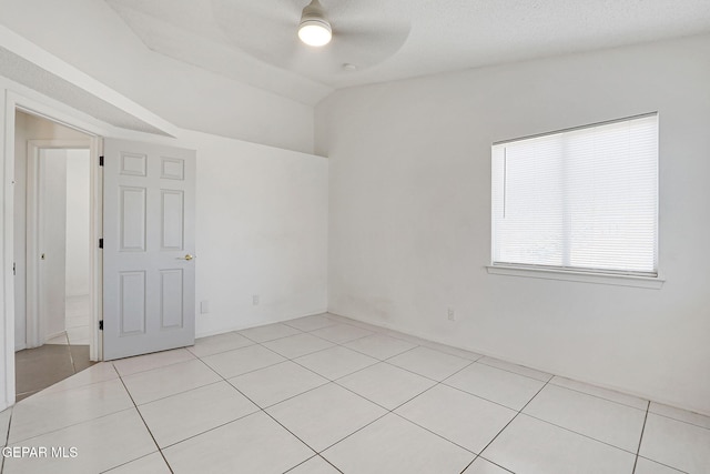 unfurnished room featuring light tile patterned flooring and ceiling fan