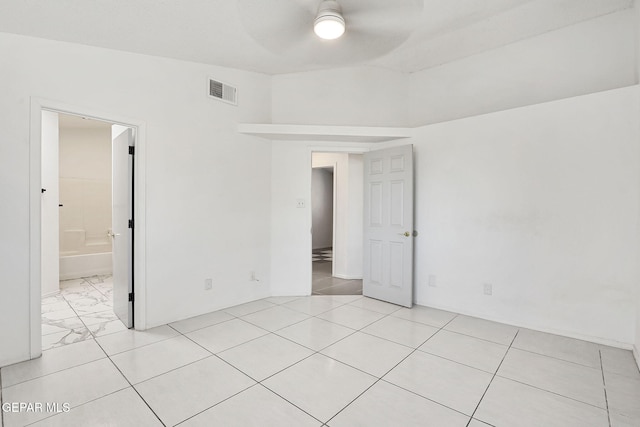 empty room featuring visible vents and ceiling fan