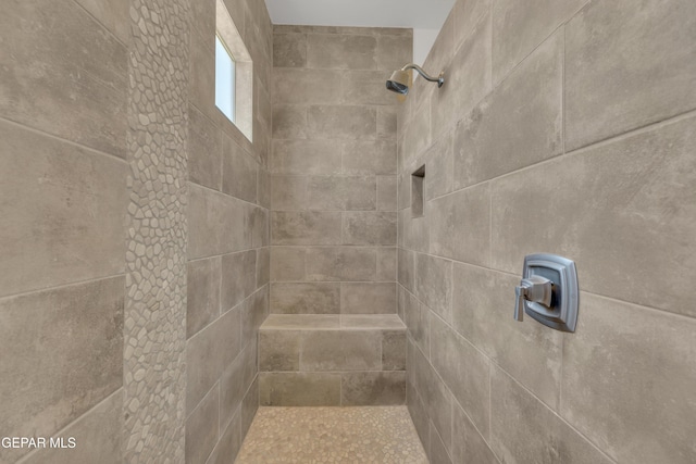 details with a tile shower