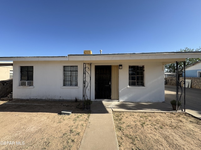 ranch-style home with stucco siding