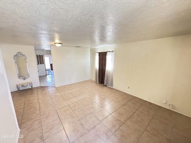 5013 Vulcan Ave, El Paso, TX 79904 - spare room featuring light tile patterned floors and a textured ceiling