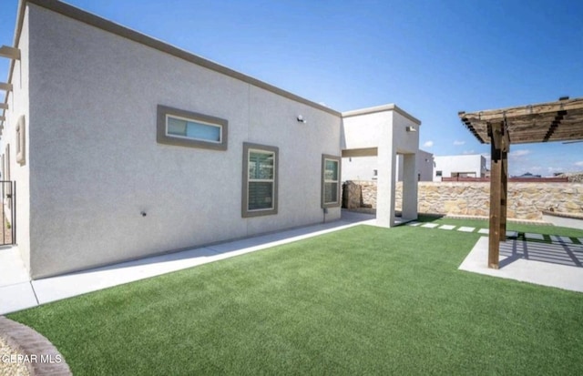 view of yard with a pergola and a patio area