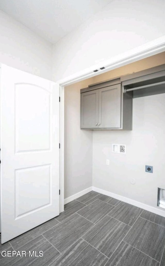 laundry area featuring cabinet space, washer hookup, electric dryer hookup, baseboards, and gas dryer hookup
